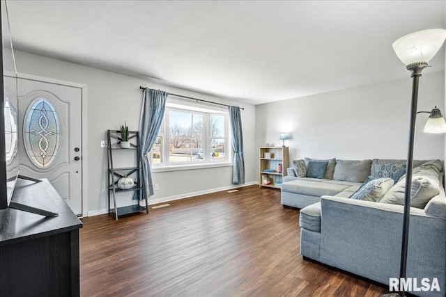 living room with dark wood-style floors and baseboards