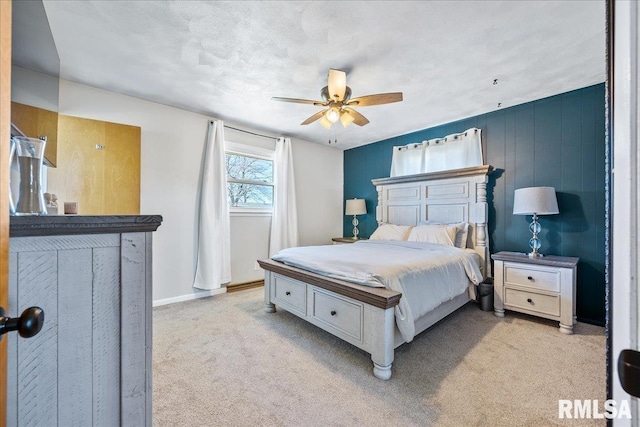 bedroom featuring baseboards, a ceiling fan, and carpet flooring