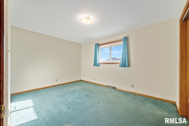 unfurnished bedroom with carpet flooring, baseboards, and visible vents