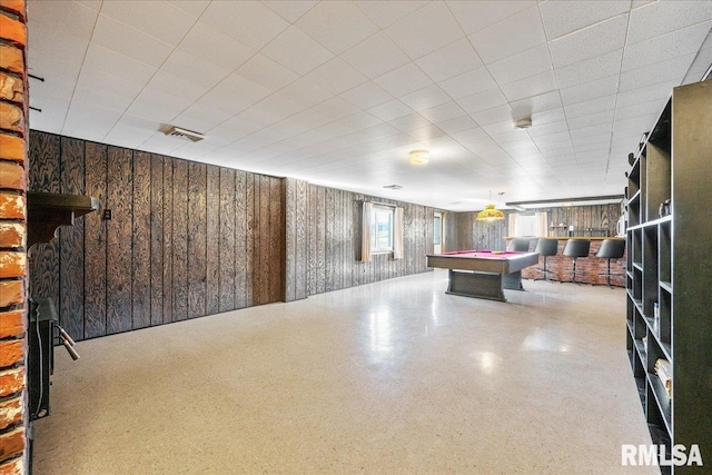 game room with visible vents, speckled floor, billiards, and wood walls