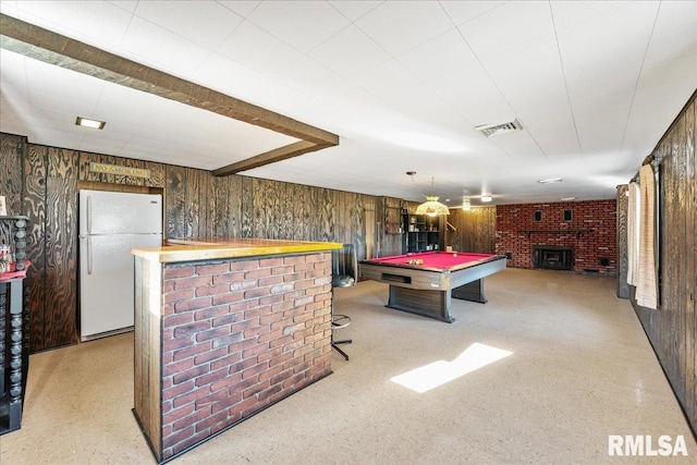 recreation room with billiards, wooden walls, visible vents, a bar, and a brick fireplace