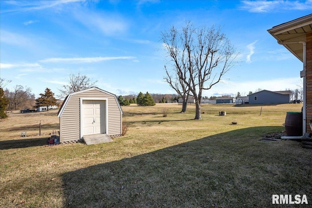 view of yard with an outbuilding and a shed