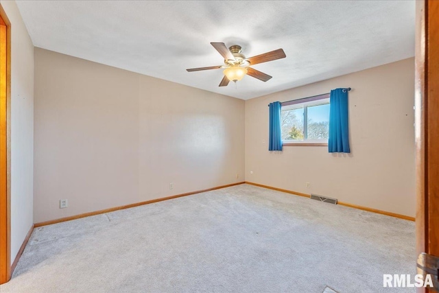 unfurnished bedroom with visible vents, baseboards, ceiling fan, and carpet flooring