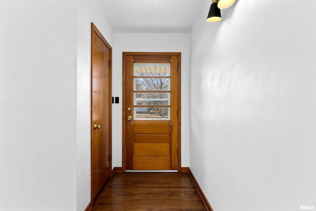 corridor with baseboards and dark wood-style flooring