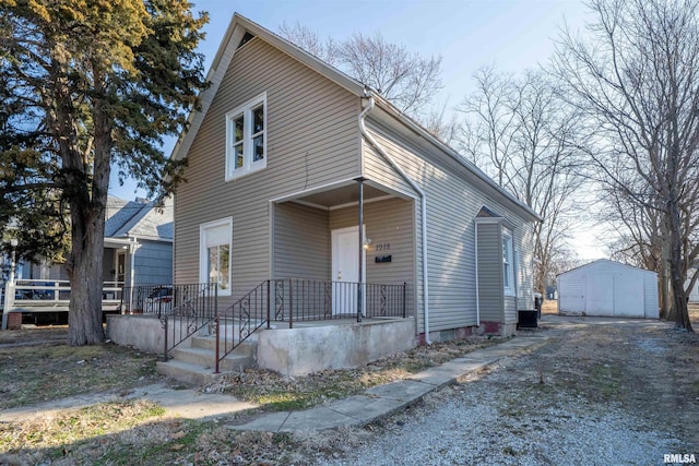 view of front of property with an outdoor structure and cooling unit