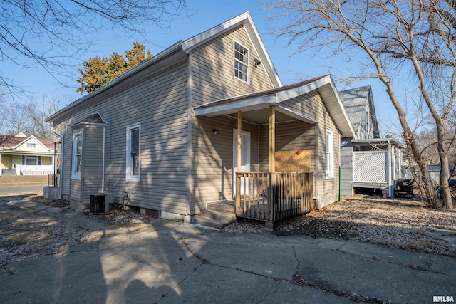 exterior space with cooling unit and covered porch