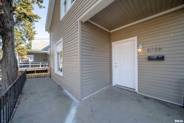 entrance to property featuring a patio