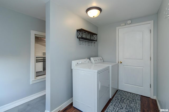 laundry room featuring laundry area, dark wood-type flooring, baseboards, and separate washer and dryer