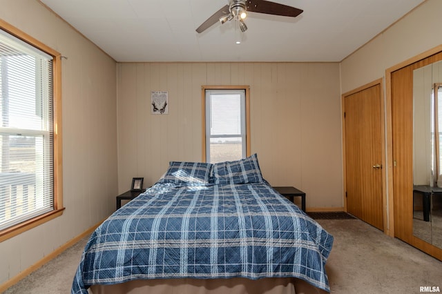 bedroom featuring a ceiling fan and carpet