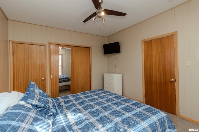 bedroom featuring a ceiling fan and carpet