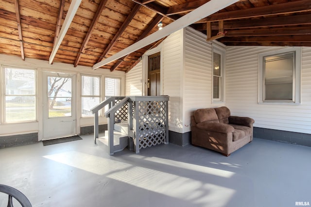 sunroom / solarium with wooden ceiling and vaulted ceiling with beams