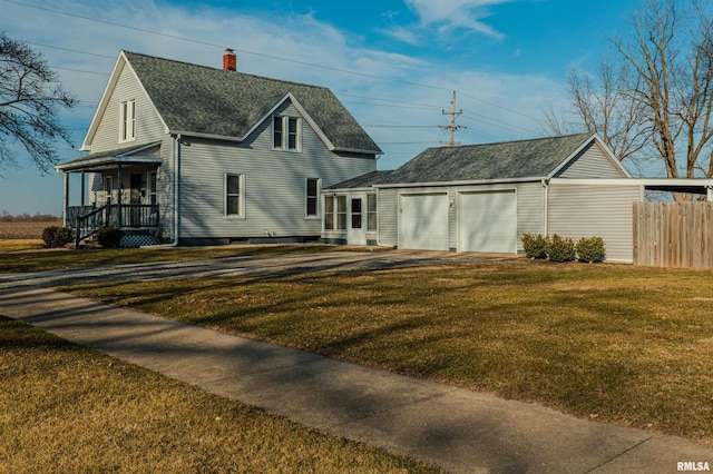 view of front of house with fence, roof with shingles, a front yard, a garage, and a chimney