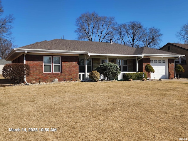 single story home featuring a front lawn, a garage, and brick siding