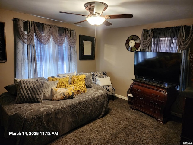 living room featuring carpet, baseboards, and ceiling fan