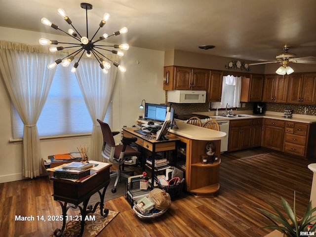 kitchen featuring dark wood-style floors, backsplash, and white appliances