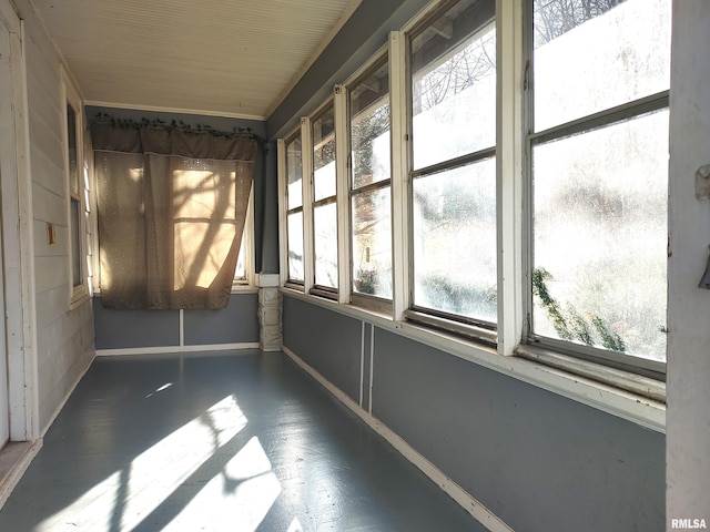 unfurnished sunroom with a wealth of natural light