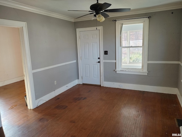 foyer featuring hardwood / wood-style floors, crown molding, a ceiling fan, and baseboards