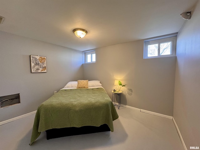 bedroom featuring visible vents and baseboards