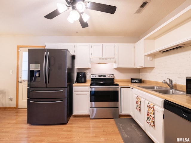 kitchen with visible vents, open shelves, a sink, under cabinet range hood, and appliances with stainless steel finishes