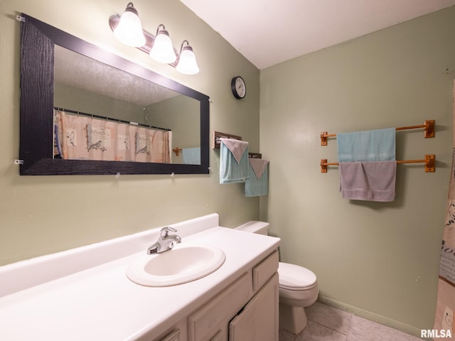 bathroom with tile patterned flooring, baseboards, toilet, a shower with shower curtain, and vanity