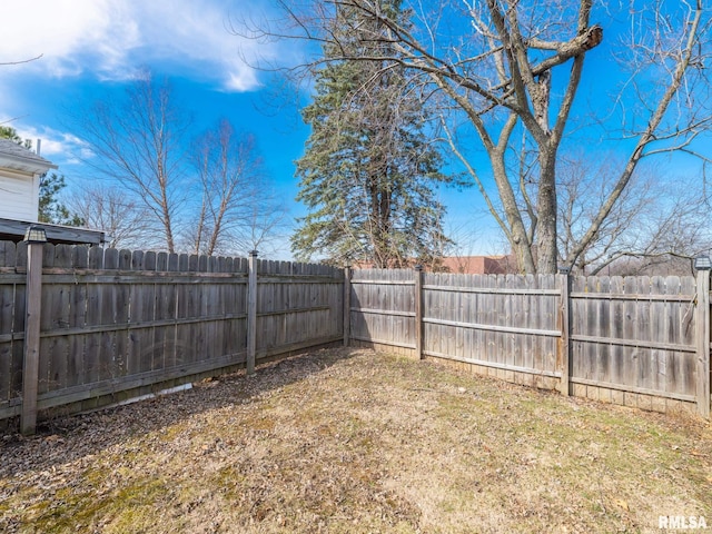 view of yard featuring a fenced backyard