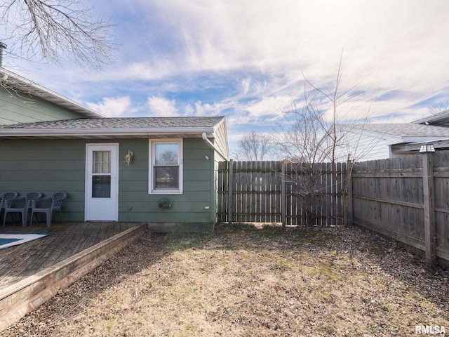 view of yard featuring a wooden deck and a fenced backyard