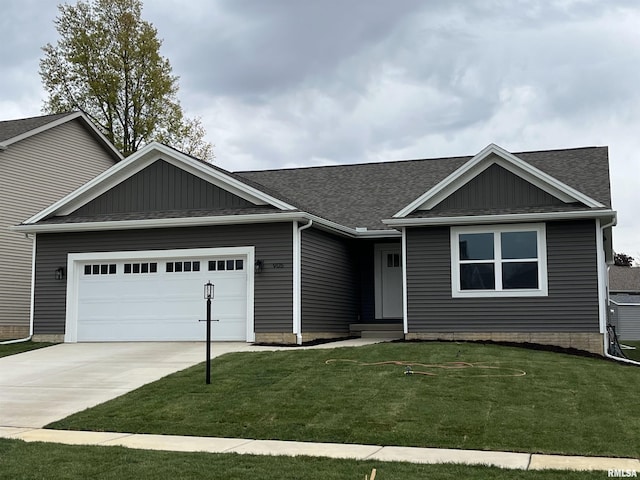 single story home with concrete driveway, roof with shingles, an attached garage, and a front yard