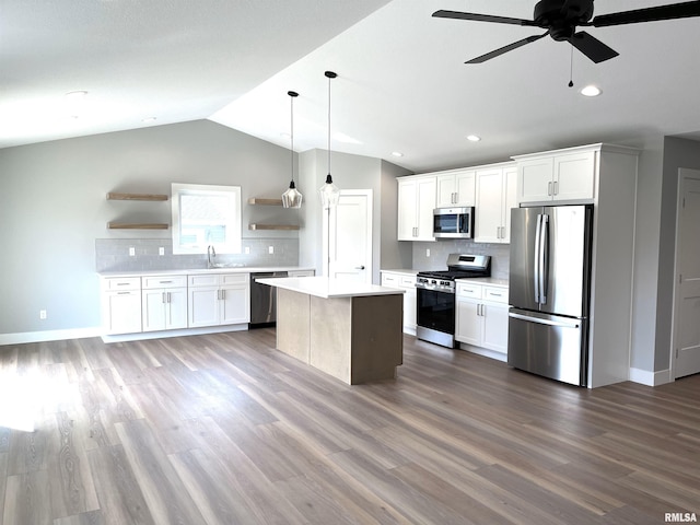kitchen featuring backsplash, stainless steel appliances, open shelves, and lofted ceiling