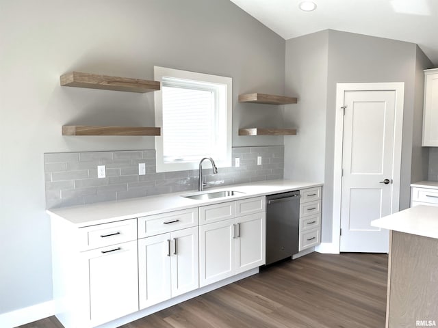 kitchen with open shelves, decorative backsplash, light countertops, a sink, and dishwasher