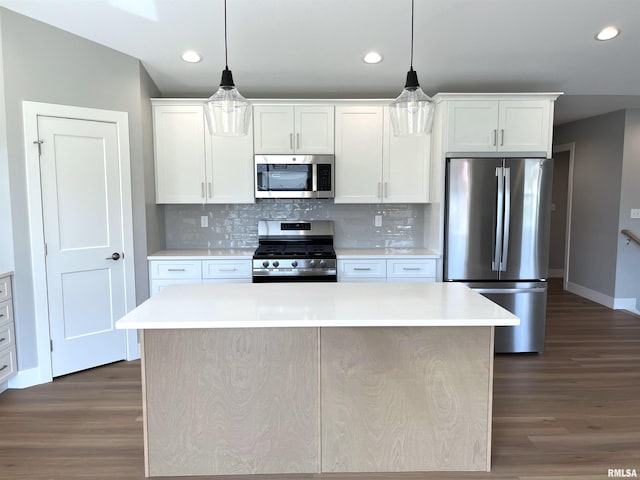 kitchen with light countertops, stainless steel appliances, recessed lighting, and dark wood-type flooring