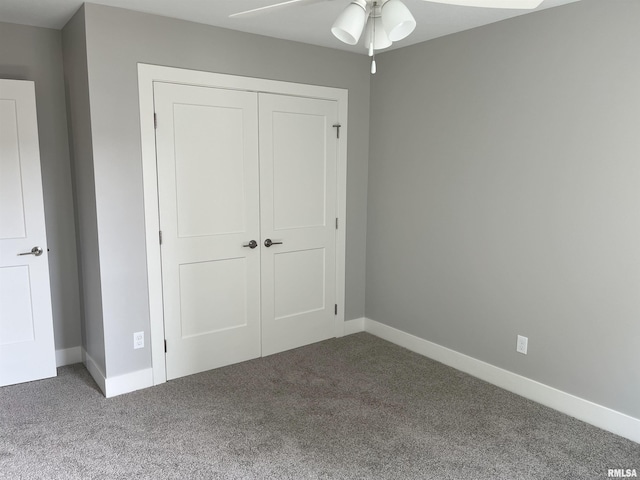 unfurnished bedroom featuring a closet, carpet, and baseboards
