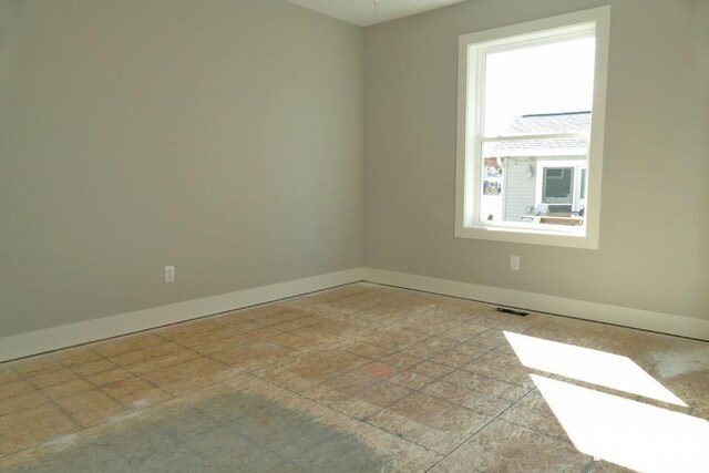 bathroom featuring wood finished floors, baseboards, and a sink