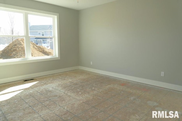 empty room with baseboards