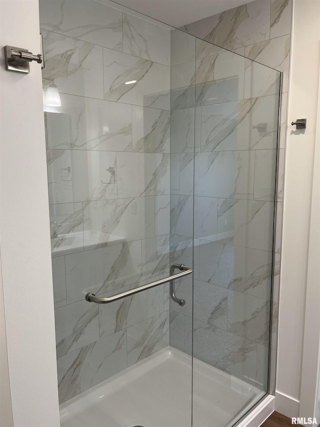 full bathroom with a shower stall