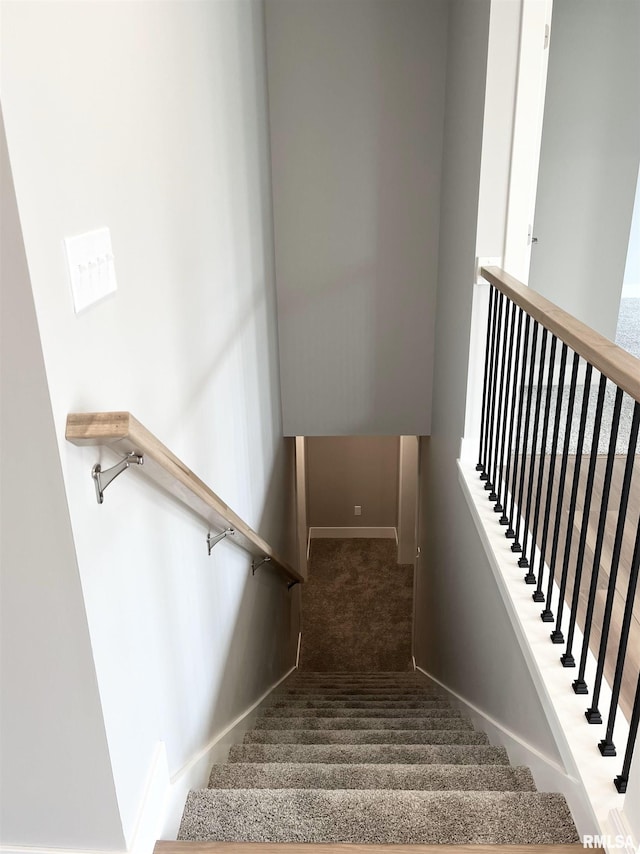 stairs with baseboards and carpet