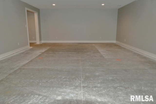 unfurnished room featuring recessed lighting and baseboards