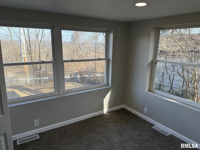 unfurnished room featuring recessed lighting, baseboards, visible vents, and dark colored carpet