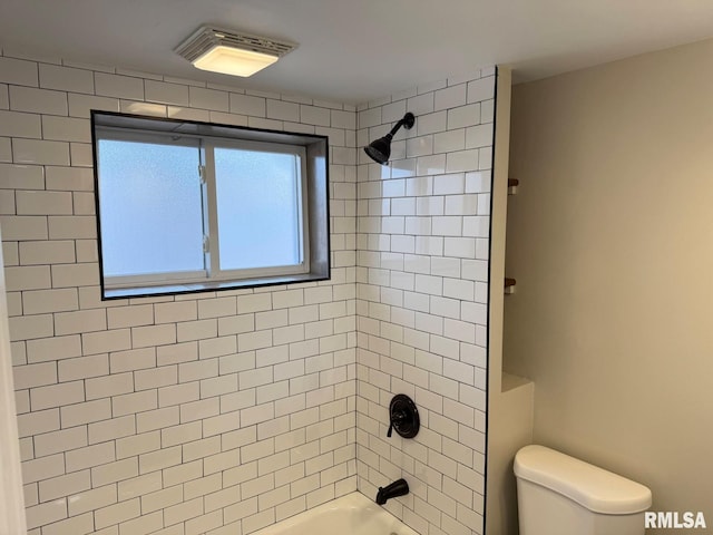 bathroom with shower / bathing tub combination and toilet