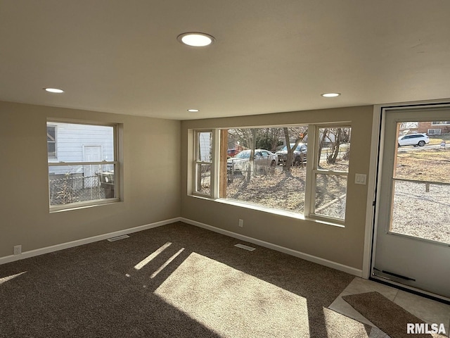 spare room featuring recessed lighting, baseboards, visible vents, and carpet floors