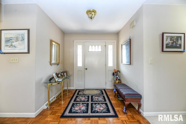 entryway featuring baseboards