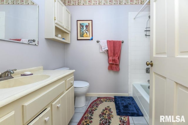 bathroom featuring tile patterned floors, toilet, baseboards, bathtub / shower combination, and vanity