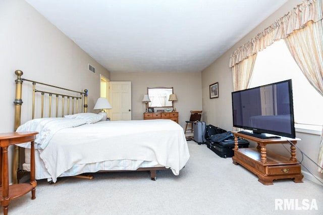 bedroom featuring visible vents and carpet floors