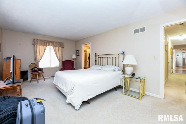 bedroom with visible vents, light colored carpet, and baseboards