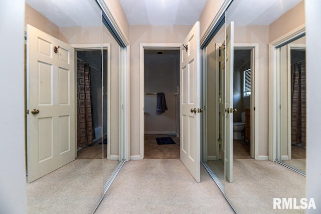 hallway featuring baseboards