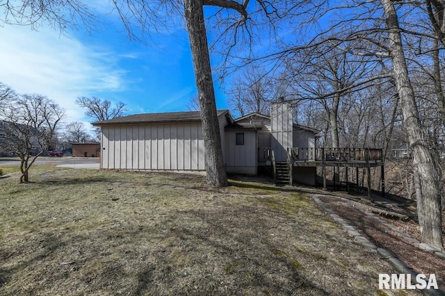 exterior space with a wooden deck and stairs