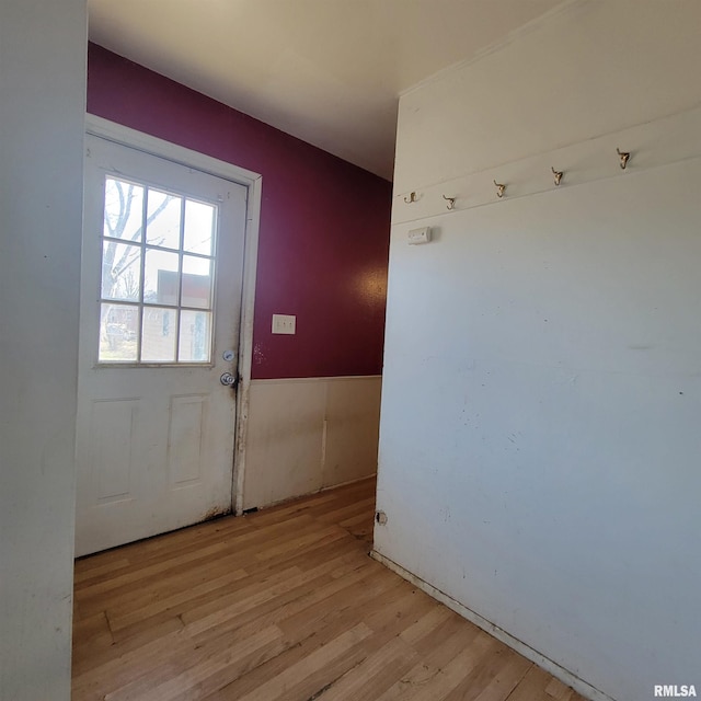 doorway with light wood finished floors