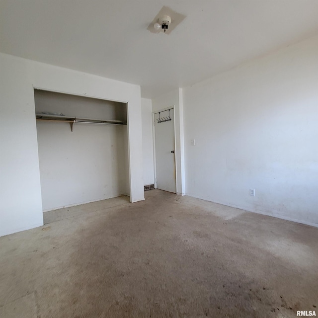 unfurnished bedroom with a closet