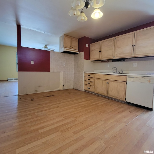 kitchen with visible vents, light wood finished floors, light brown cabinetry, white dishwasher, and light countertops