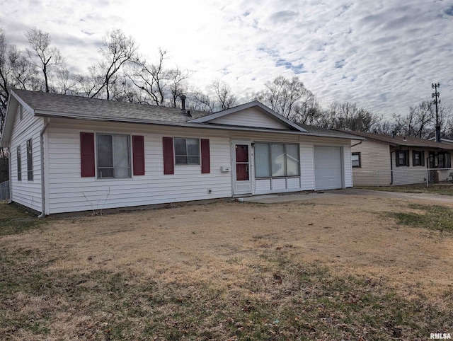 single story home featuring a front yard and an attached garage