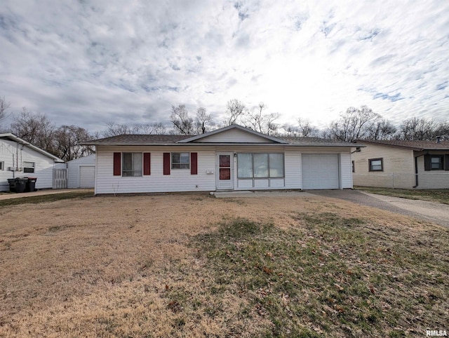 1704 Lamar Dr, Pekin, IL 61554 - single story home with an attached garage, driveway, a front lawn, and a storage shed
